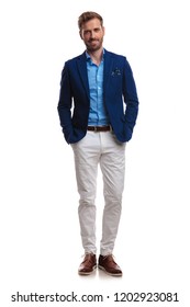 Happy Young Smart Casual Man Standing With Hands In Pockets On White Background