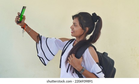 Happy Young Student Showing Smartphone With Green Screen, Social Network App. 22 September 2022, Reengus, Rajasthan, India.