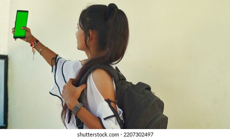 Happy Young Student Showing Smartphone With Green Screen, Social Network App. 22 September 2022, Reengus, Rajasthan, India.