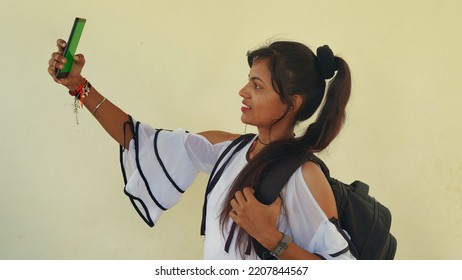 Happy Young Student Showing Smartphone With Green Screen, Social Network App. 22 September 2022, Reengus, Rajasthan, India.