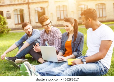 Happy Young Students Are Chatting In Campus