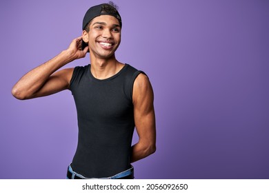 Happy Young Transgender Man Smile Portrait. Cheerful Latino Male In Black T-shirt. Purple Background