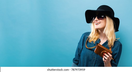 Happy Young Traveling Woman On A Solid Background