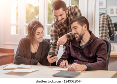 Happy young university students studying with laptop in library. Group of multiracial people in college library sitting together at table with books and laptop. Happy young people.  - Shutterstock ID 1243022044