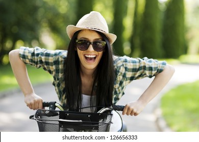 Happy Young Woman With Bicycle