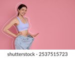 Happy young woman in big jeans showing her slim body on pink background, space for text. Dashed line around repeating her figure