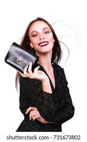  Happy Young Woman In A Black Dress With A Purse  Over White Background  