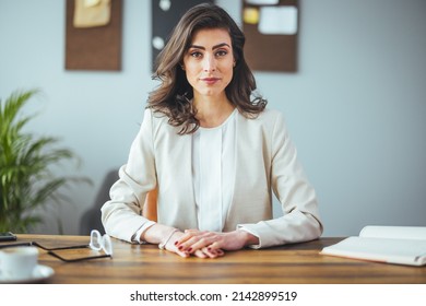 Happy young woman blogger applicant teacher sit at home office look at camera doing online job interview during video chat conference call record vlog teaching on webinar in app, webcam view