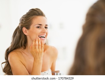 Happy Young Woman Checking Teeth In Shower Teeth In Mirror