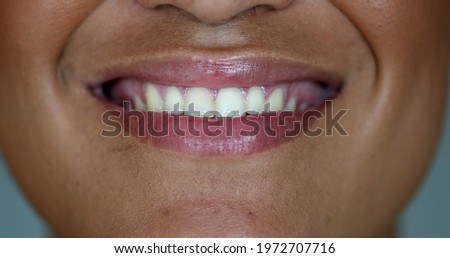 Happy young woman close-up mouth smiling