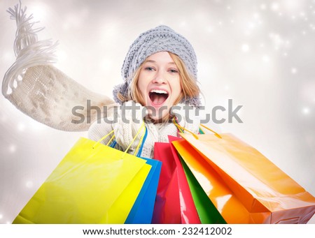 Happy Young Woman with Colorful Shopping Bag