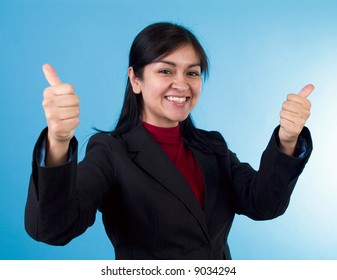 A happy young woman displaying extreme approval with a thumbs up gesture.