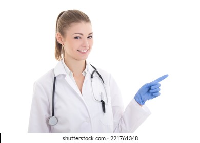 Happy Young Woman Doctor Pointing At Something Isolated On White Background