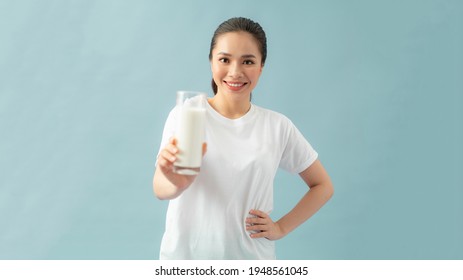 Happy Young Woman Drinking Milk