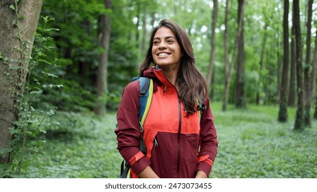 Happy young woman enjoying in the beautiful forest - Powered by Shutterstock