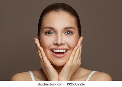 Happy Young Woman Face With Clear Skin On Brown Background, Closeup Portrait