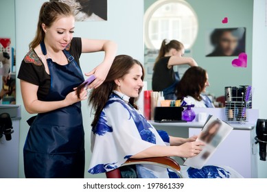 Happy Young Woman Getting A New Haircut By Hairdresser At Parlor