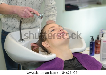 happy young woman at hairdresser