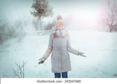 Happy Young Woman Having Fun In The Snow