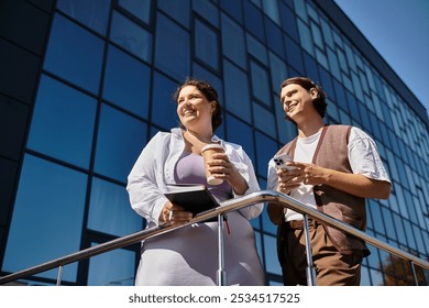 A happy young woman and her friend enjoy the sun and chat on a balcony. - Powered by Shutterstock