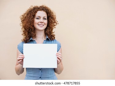 Happy Young Woman Holding Blank White Banner