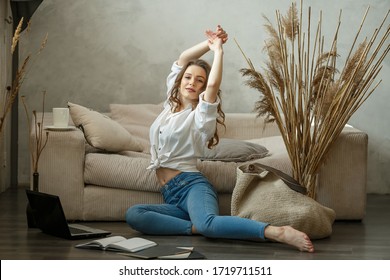 Happy  Young Woman At Home.Remote Work At Home During Quarantine.Distance Learning.Girl Rest On Sofa Meditate Relieve Negative Emotions On Weekend At Home.Cozy Morning.Girl With Laptop. Freelancer 