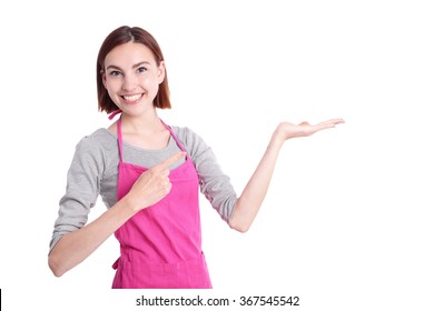 Happy young woman housewife showing something Wearing Kitchen Apron Over White Background, caucasian - Shutterstock ID 367545542