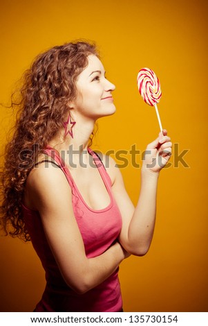 happy young woman with lollipop