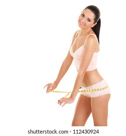 happy young woman with measure tape