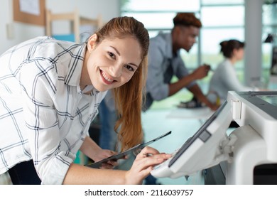 Happy Young Woman On Printer Maintenance