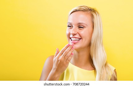 Happy Young Woman On A Solid Background