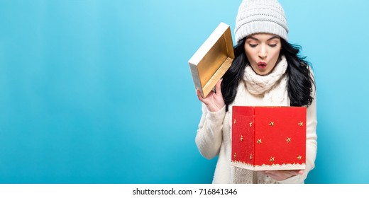 Happy Young Woman Opening A Christmas Present Box