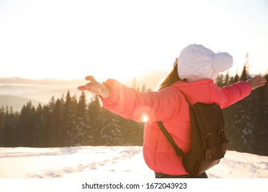 Happy Young Woman Outdoors On Snowy Winter Day