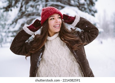 Happy Young Woman Plays With A Snow In Sunny Winter Day. Walk In Winter Forest. Christmas,  Holidays Concept.