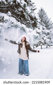 Happy Young Woman Plays With A Snow In Sunny Winter Day. Walk In Winter Forest. Christmas,  Holidays Concept.