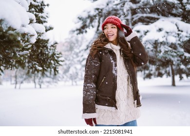 Happy Young Woman Plays With A Snow In Sunny Winter Day. Walk In Winter Forest. Christmas,  Holidays Concept.