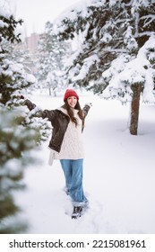 Happy Young Woman Plays With A Snow In Sunny Winter Day. Walk In Winter Forest. Christmas,  Holidays Concept.