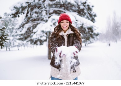 Happy Young Woman Plays With A Snow In Sunny Winter Day. Walk In Winter Forest. Christmas,  Holidays Concept.