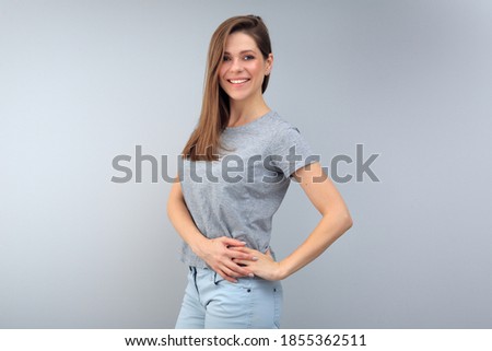 Happy young woman portait on gray background. 