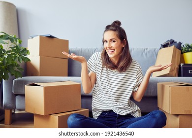 Happy Young Woman Posing In New Apartment During Moving In