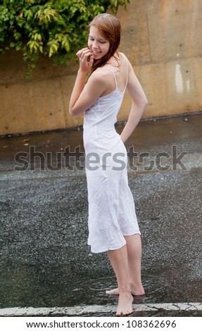 Happy Young Woman in Rain