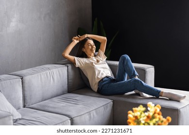 Happy young woman relaxing at home. Good weekend. - Powered by Shutterstock