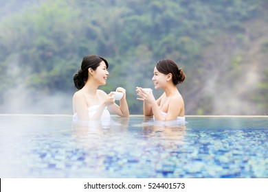 Happy Young Woman Relaxing In  Hot Springs