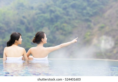 Happy Young Woman Relaxing In  Hot Springs