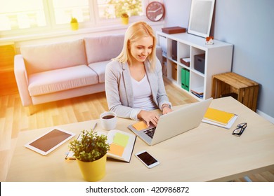 Happy Young Woman Running Small Business From Home Office, Working On Laptop