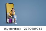 Happy young woman with shopping bags in a smartphone, online shopping and sales concept, blank copy space