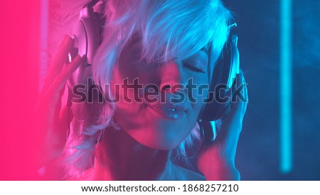 Similar – Young woman dancing and listening to music