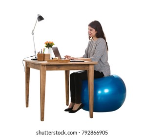 Happy Young Woman Sitting On Pilate Ball Working On Laptop - Powered by Shutterstock