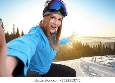 Happy young woman with ski goggles taking selfie in mountains - Powered by Shutterstock