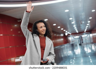 Happy Young Woman Standing On The Subway Platform.